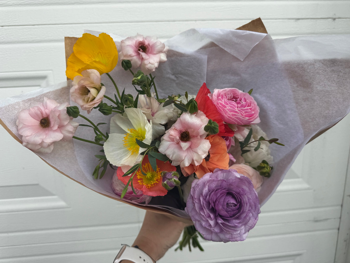 Wrapped bouquet of Spring flowers